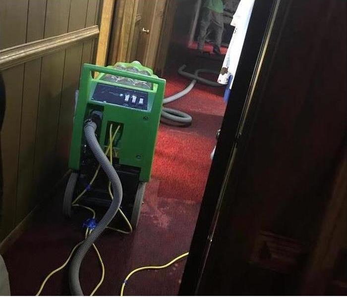 Image of dyring equipment placed in basement hall after suffering flooding