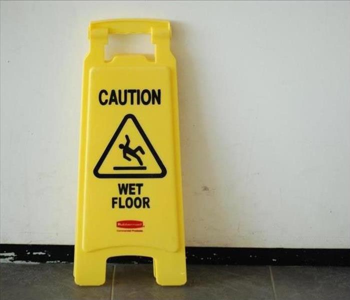 "Caution wet floor" sign.